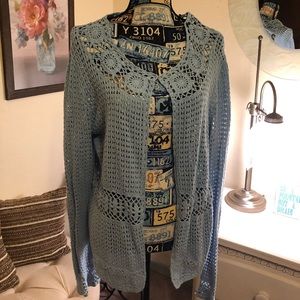 Powder blue crocheted cardigan.